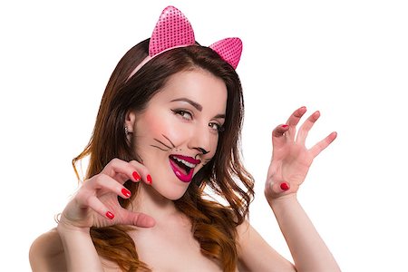 ear bite - Playful lovely female in a role of catwoman make-up isolated on white Stock Photo - Budget Royalty-Free & Subscription, Code: 400-08107569