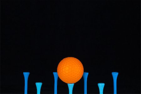 simsearch:400-07218299,k - Golf balls and wooden tees on a black background Stock Photo - Budget Royalty-Free & Subscription, Code: 400-08107652