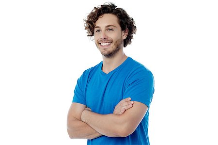 simsearch:693-03707560,k - Cheerful young guy posing with folded arms Fotografie stock - Microstock e Abbonamento, Codice: 400-08107837