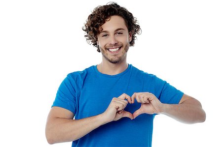 Handsome guy making heart shape with his hands Stock Photo - Budget Royalty-Free & Subscription, Code: 400-08107865