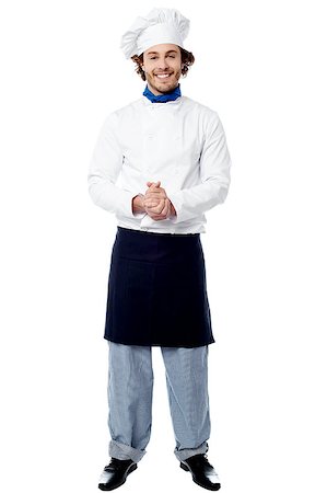 Smiling confident chef isolated over white Stock Photo - Budget Royalty-Free & Subscription, Code: 400-08107896