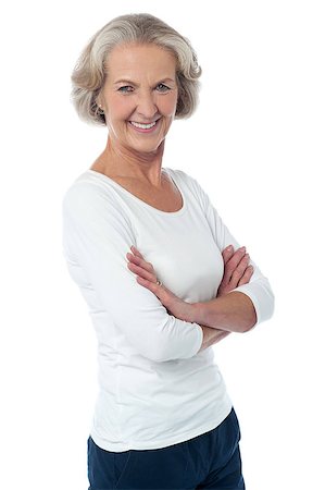simsearch:693-03707560,k - Aged woman with crossed arms isolated over white Fotografie stock - Microstock e Abbonamento, Codice: 400-08107912