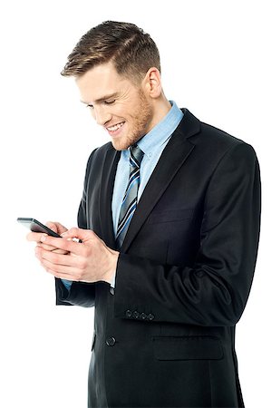 simsearch:400-07514126,k - Corporate guy sending text message Fotografie stock - Microstock e Abbonamento, Codice: 400-08108111