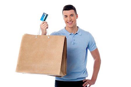 simsearch:400-07833752,k - Young man showing his shopping bag and credit card Foto de stock - Super Valor sin royalties y Suscripción, Código: 400-08108154