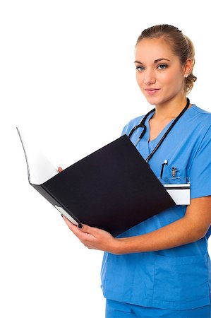 simsearch:400-05745246,k - Young female physician reviewing patients records Photographie de stock - Aubaine LD & Abonnement, Code: 400-08108246