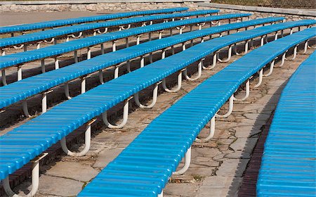 simsearch:400-06087440,k - Row of blue wooden seats on a spectator grandstand photo. Bench in the park for the show Foto de stock - Royalty-Free Super Valor e Assinatura, Número: 400-08108470