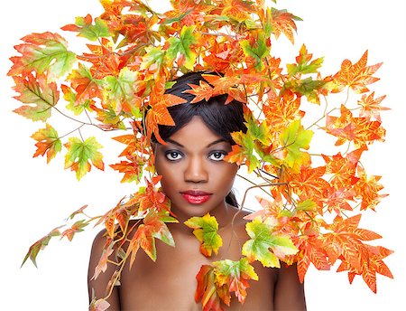 Beautiful young woman wrapped in autumn leafs Stock Photo - Budget Royalty-Free & Subscription, Code: 400-08108594
