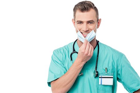 simsearch:400-08131186,k - Male doctor removing his surgical mask Foto de stock - Royalty-Free Super Valor e Assinatura, Número: 400-08108868