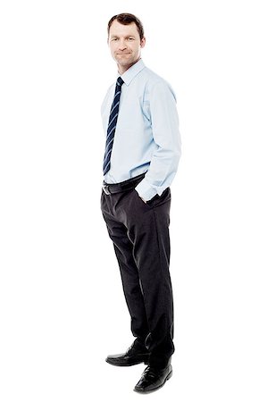 secretary model - Handsome businessman standing with his hands in pockets Stock Photo - Budget Royalty-Free & Subscription, Code: 400-08109009