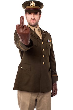 Evil gesture by angry young military man Stock Photo - Budget Royalty-Free & Subscription, Code: 400-08109050