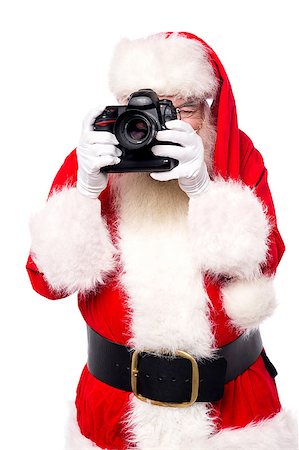 Santa claus taking photos with his new camera Stock Photo - Budget Royalty-Free & Subscription, Code: 400-08109284