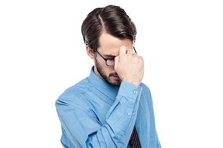 eyeglasses forehead - Depressed man holding hand to forehead Stock Photo - Budget Royalty-Free & Subscription, Code: 400-08109310