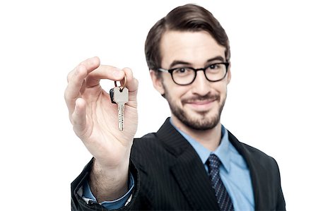Realtor man showing the keys to an apartment Stock Photo - Budget Royalty-Free & Subscription, Code: 400-08109321