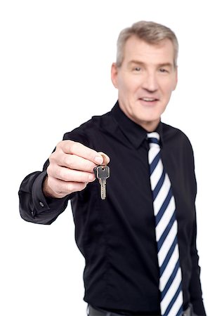 Real estate agent showing the keys to camera Stock Photo - Budget Royalty-Free & Subscription, Code: 400-08109599