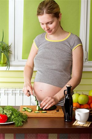 pregnant cooking - Pregnant woman on kitchen cooking healthy food Stock Photo - Budget Royalty-Free & Subscription, Code: 400-08109803