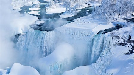 Detail of Niagara's Bridal Veil Falls covered in the ice and snow of a frigid Great Lakes Winter. The image was shot from the Skylon Tower in Niagara Falls, Ontario, Canada. Stock Photo - Budget Royalty-Free & Subscription, Code: 400-08109847