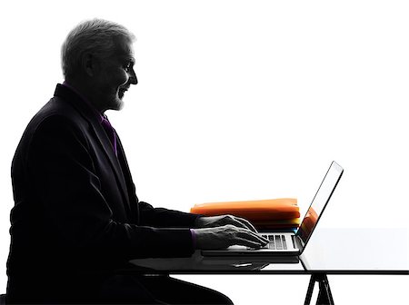 One Caucasian Senior Business Man computing laptop smiling Silhouette White Background Stock Photo - Budget Royalty-Free & Subscription, Code: 400-08109955