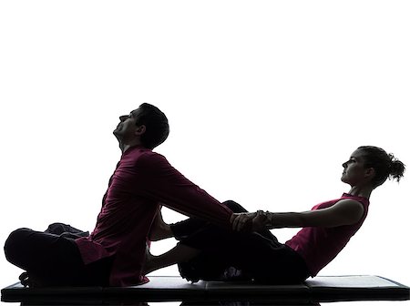 full body massage - one man and woman performing thai massage in silhouette studio on white background Foto de stock - Super Valor sin royalties y Suscripción, Código: 400-08109981