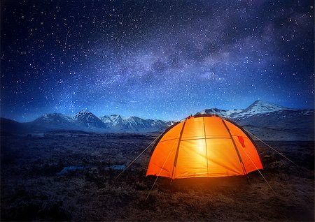 A camping tent glows under a night sky full of stars. Outdoor Camping adventure. Stock Photo - Budget Royalty-Free & Subscription, Code: 400-08114122