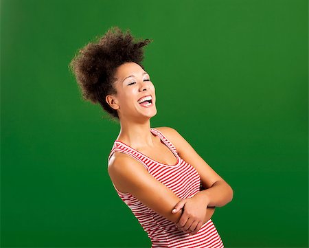 simsearch:400-06065810,k - Beautiful African woman laughing over a green background Foto de stock - Super Valor sin royalties y Suscripción, Código: 400-08114626