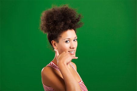 simsearch:400-06065810,k - Happy African woman doing a call sign with her hand, over a green background Foto de stock - Super Valor sin royalties y Suscripción, Código: 400-08114634