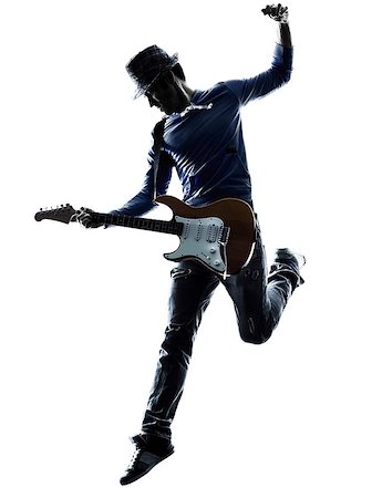 one caucasian man electric guitarist player playing in studio silhouette isolated on white background Foto de stock - Super Valor sin royalties y Suscripción, Código: 400-08115171