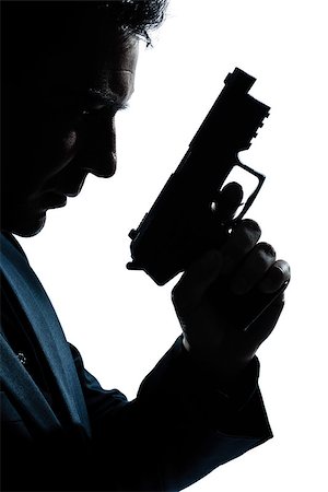 simsearch:400-07097770,k - one  spy criminal policeman detective man holding gun portrait silhouette in studio isolated white background Photographie de stock - Aubaine LD & Abonnement, Code: 400-08116058