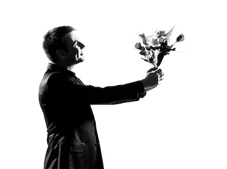 simsearch:400-07097695,k - silhouette portrait one  business man holding offering flowers bouquet on studio isolated white background Stock Photo - Budget Royalty-Free & Subscription, Code: 400-08116074