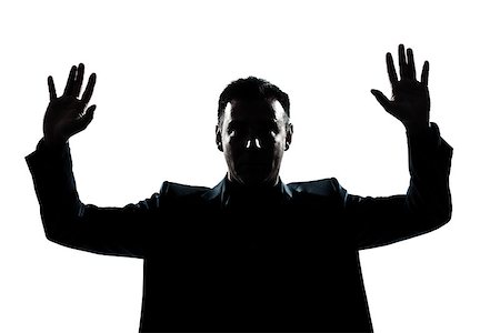 one  man portrait silhouette hands up in studio isolated white background Stock Photo - Budget Royalty-Free & Subscription, Code: 400-08116134