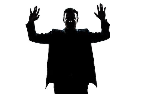 one  man portrait silhouette hands up in studio isolated white background Stock Photo - Budget Royalty-Free & Subscription, Code: 400-08116135