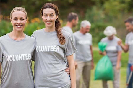 simsearch:400-08116305,k - Happy volunteer collecting rubbish on a sunny day Stock Photo - Budget Royalty-Free & Subscription, Code: 400-08116365