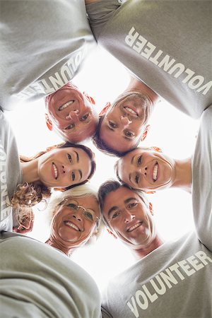 simsearch:400-08116305,k - Happy volunteer family looking down at the camera on a sunny day Stock Photo - Budget Royalty-Free & Subscription, Code: 400-08116371