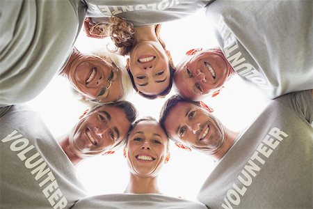 simsearch:400-08116305,k - Happy volunteer family looking down at the camera on a sunny day Stock Photo - Budget Royalty-Free & Subscription, Code: 400-08116372