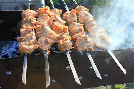 simsearch:700-00043603,k - Shashlick laying on the grill close up Stock Photo - Budget Royalty-Free & Subscription, Code: 400-08116752