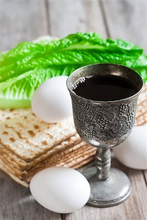 seder table - Wine, egg, bitter salad leaves, matzot - traditional jewish passover celebration elements. Stock Photo - Budget Royalty-Free & Subscription, Code: 400-08110278