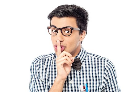Handsome young man silence gesture with finger on his lips Stock Photo - Budget Royalty-Free & Subscription, Code: 400-08110527