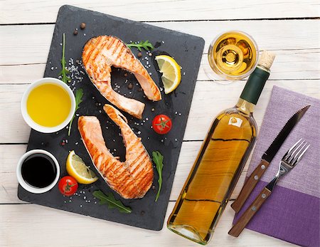 salmon cooked - Grilled salmon and white wine on wooden table. Top view Stock Photo - Budget Royalty-Free & Subscription, Code: 400-08110707