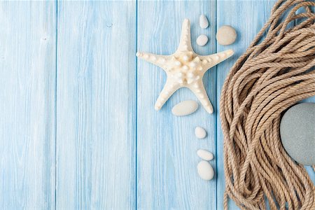 seashell photo concept - Summer time sea vacation background with star fish and marine rope Stock Photo - Budget Royalty-Free & Subscription, Code: 400-08110711