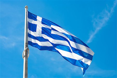 Flag of Greece waving in the wind against a blue sky Stockbilder - Microstock & Abonnement, Bildnummer: 400-08110980