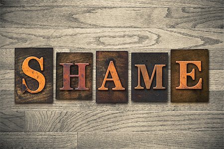 simsearch:400-08152413,k - The word "SHAME" theme written in vintage, ink stained, wooden letterpress type on a wood grained background. Foto de stock - Super Valor sin royalties y Suscripción, Código: 400-08111084