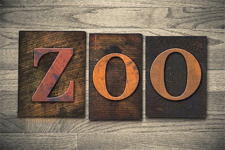 simsearch:400-08152413,k - The word "ZOO" theme written in vintage, ink stained, wooden letterpress type on a wood grained background. Foto de stock - Super Valor sin royalties y Suscripción, Código: 400-08111097