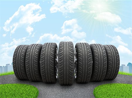 simsearch:400-08159883,k - Wedge of new car wheels on road fork. City and blue sky with cloud as basckdrop Fotografie stock - Microstock e Abbonamento, Codice: 400-08111204