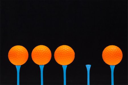 simsearch:400-07218299,k - Golf balls on blue wooden tees Stock Photo - Budget Royalty-Free & Subscription, Code: 400-08111458