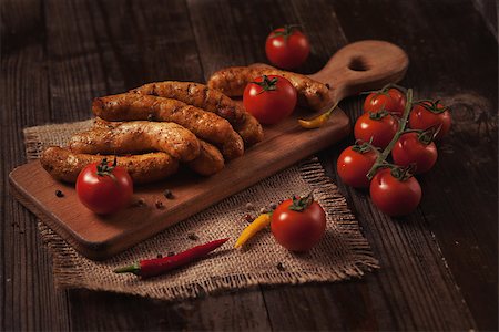 simsearch:400-08250243,k - Grilled sausage with fresh herbs on wodden table Fotografie stock - Microstock e Abbonamento, Codice: 400-08111461