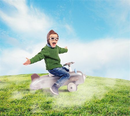 Cheerful boy kid playing at the aviator Stock Photo - Budget Royalty-Free & Subscription, Code: 400-08111526