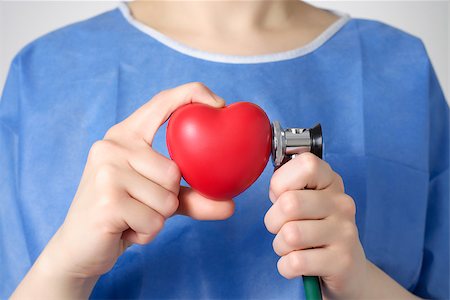 Red heart and stethoscope in the hand of a doctor Stock Photo - Budget Royalty-Free & Subscription, Code: 400-08111558