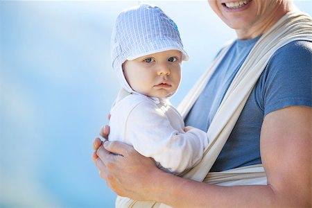 Cute toddler boy in sling, father carrying son outdoors Stock Photo - Budget Royalty-Free & Subscription, Code: 400-08111729