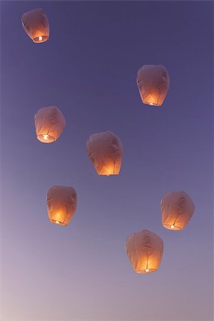 A group of flying lanterns being released into the nightsky Stock Photo - Budget Royalty-Free & Subscription, Code: 400-08111823