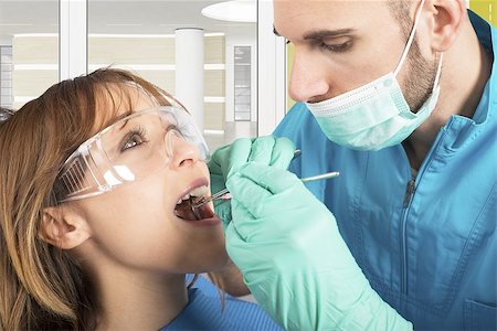 Dentist effects a cleaning of the teeth Stock Photo - Budget Royalty-Free & Subscription, Code: 400-08111867