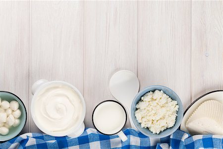 simsearch:400-07825089,k - Dairy products on wooden table. Sour cream, milk, cheese, yogurt and butter. Top view with copy space Stockbilder - Microstock & Abonnement, Bildnummer: 400-08112037